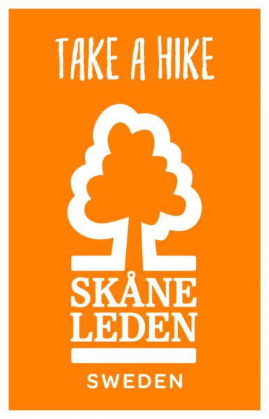 Orange tygm&auml;rke med Sk&aring;neledens logotyp